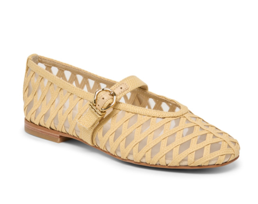 Beige flat shoe with cut-out design on a white background
