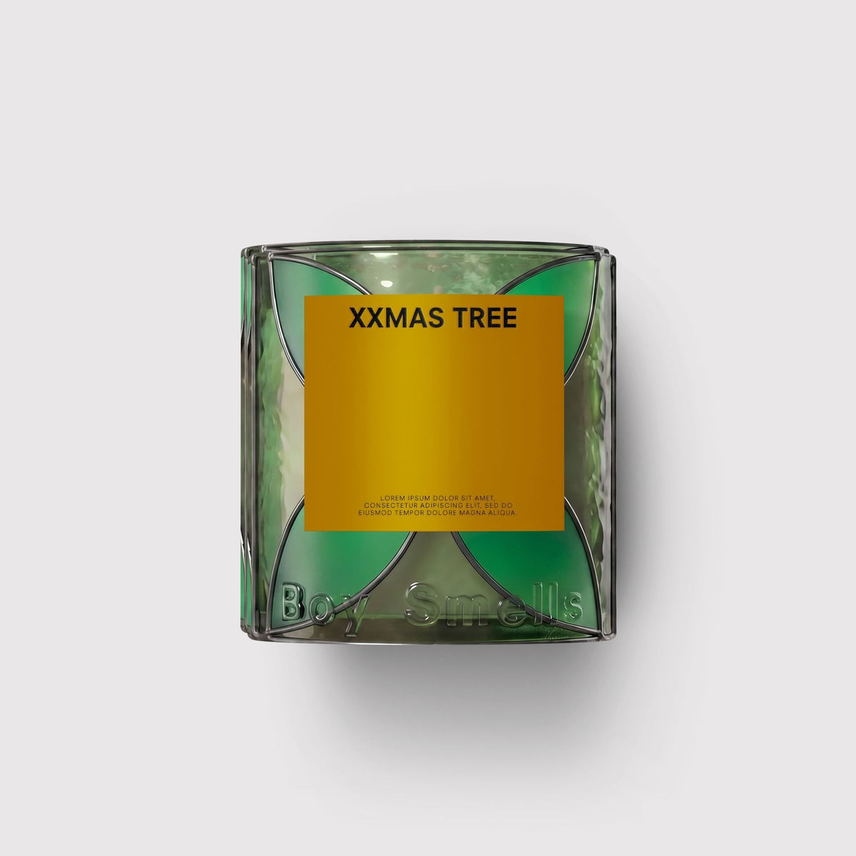 Candle in a clear container with a yellow label on a white background