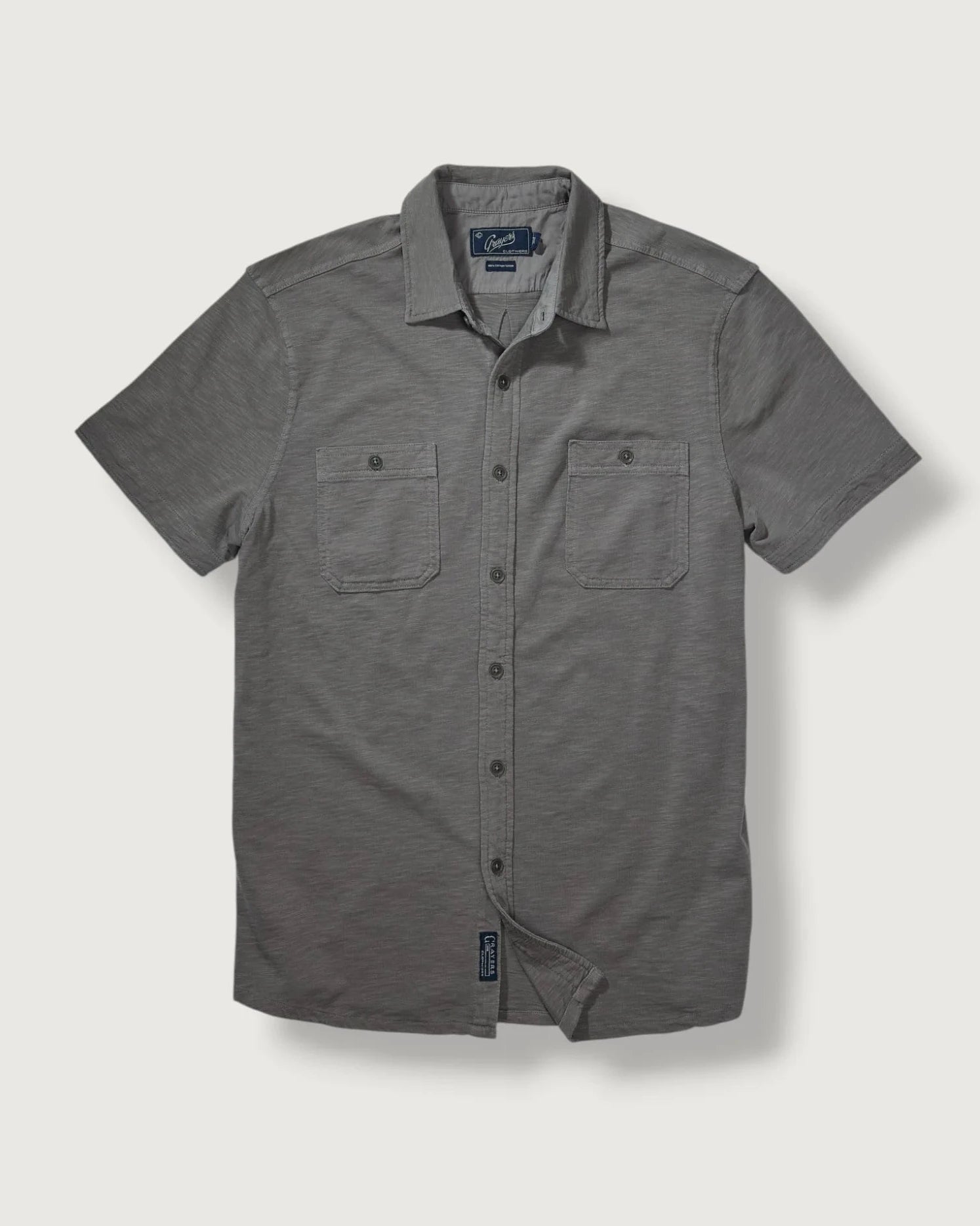 Gray short-sleeve button-up shirt on a light gray background