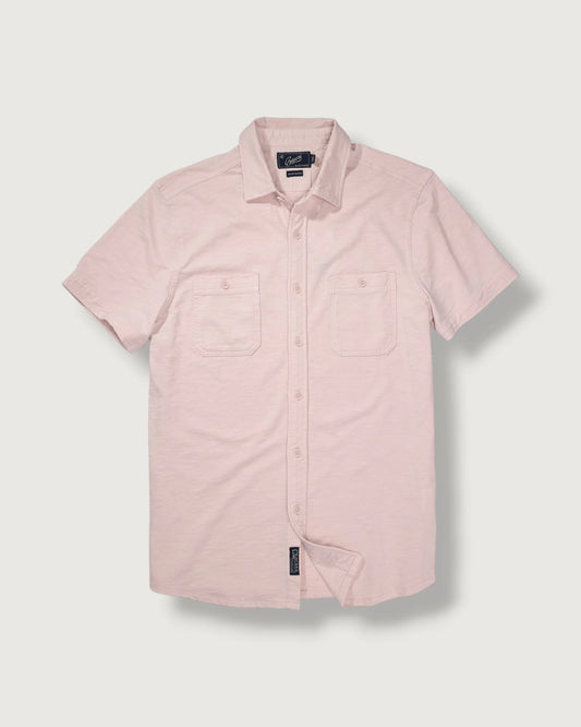 Pink short-sleeve shirt on a light gray background