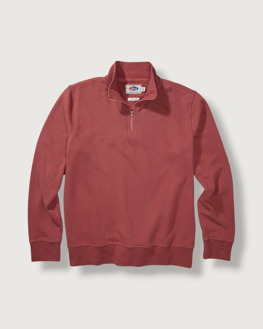 Red pullover with a brand logo on a light gray background