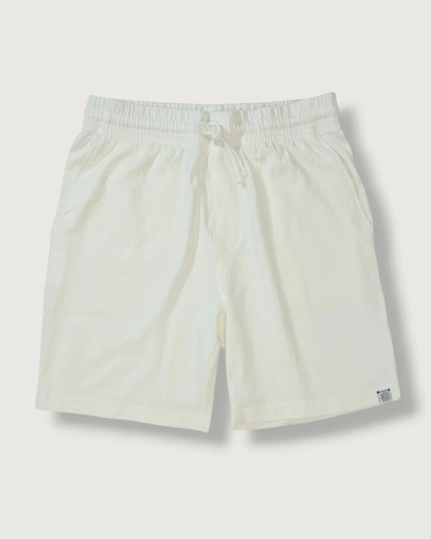 Beige shorts on a light gray background