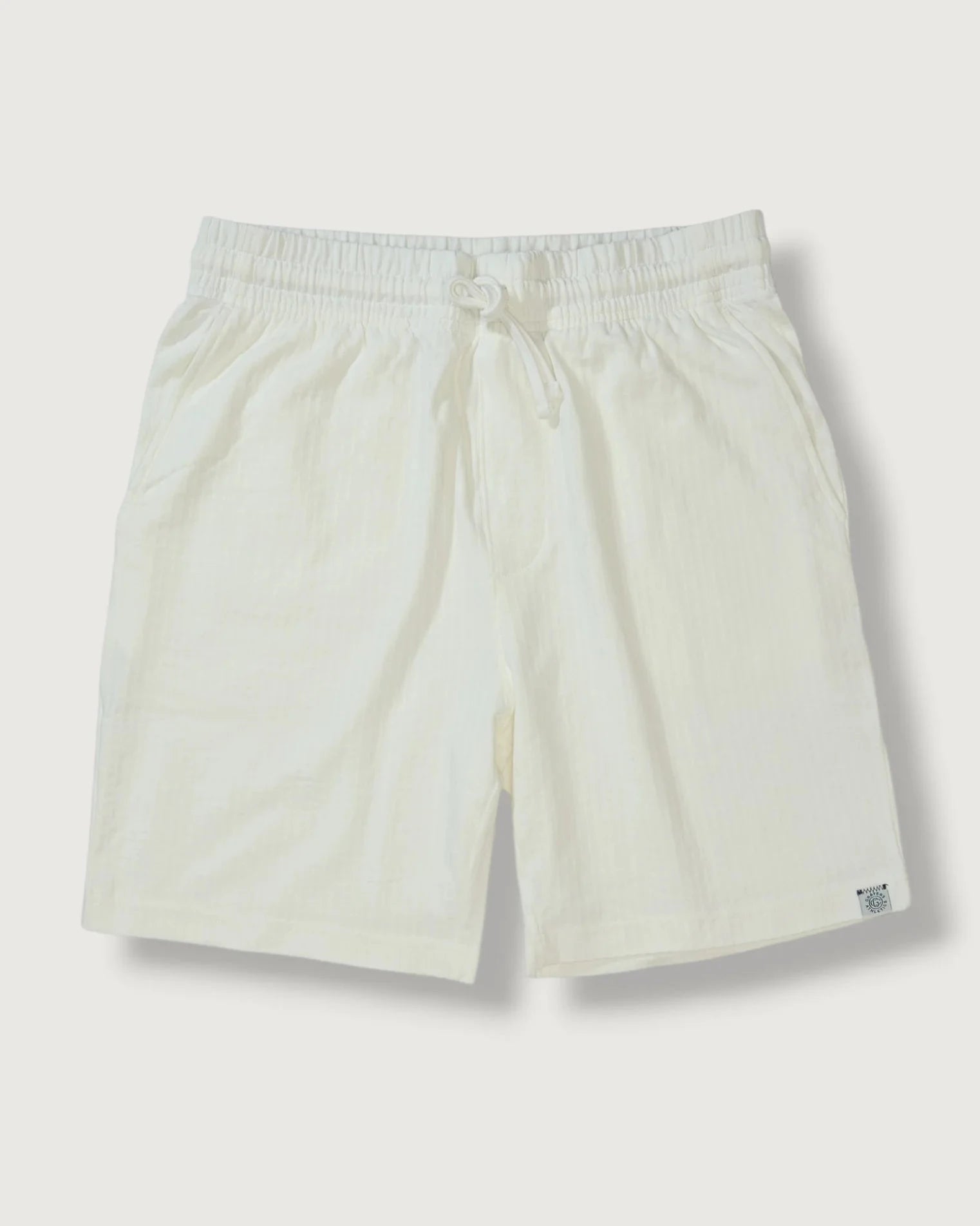 Beige shorts on a light gray background
