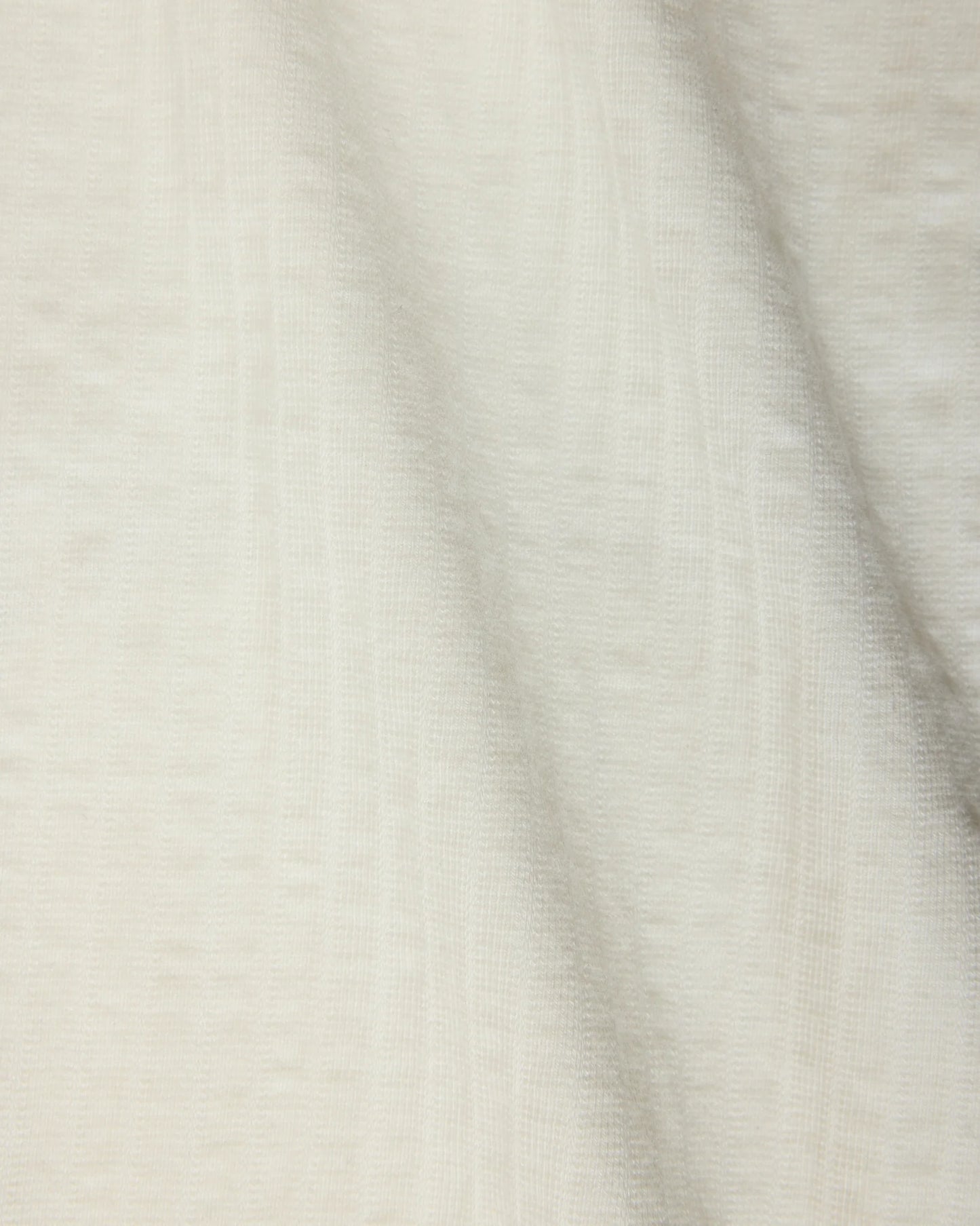 Close-up of textured beige fabric