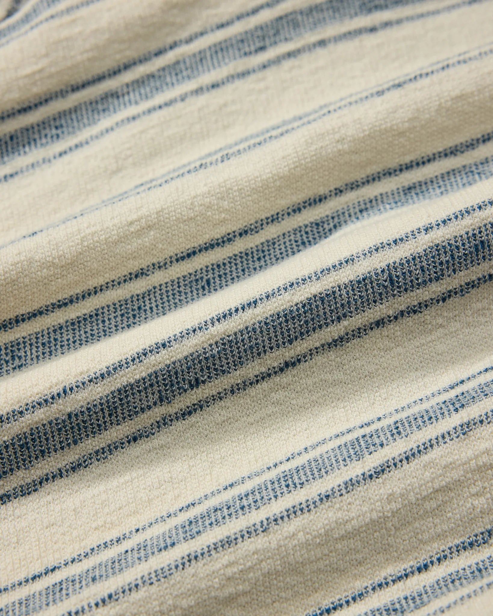 Close-up of fabric with blue and beige stripes