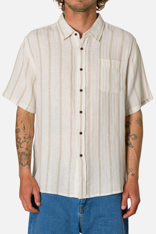 Man wearing a beige striped shirt with short sleeves on a white background