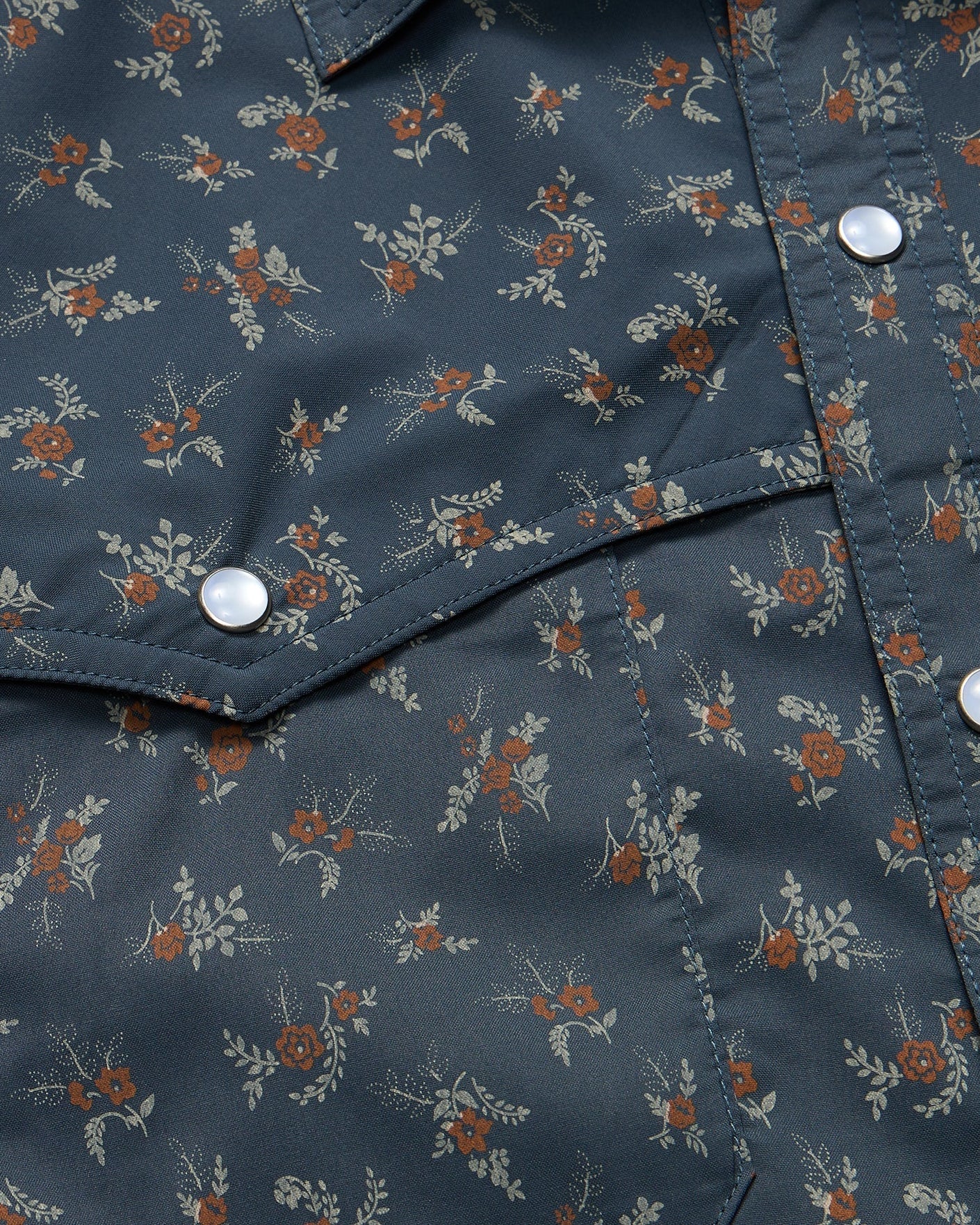 Floral patterned shirt with a close-up of the fabric texture.