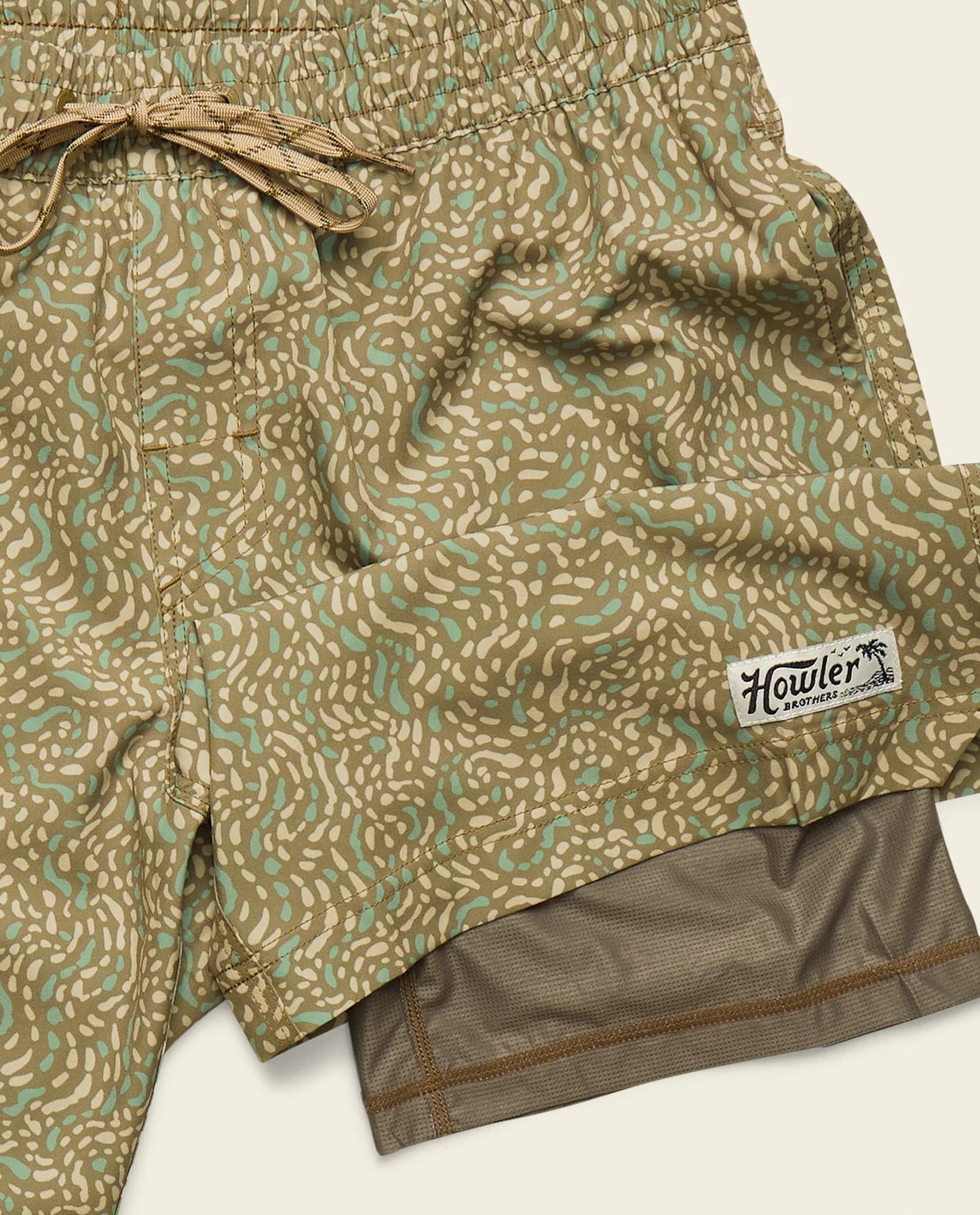 Patterned shorts with a visible brand label on a white background