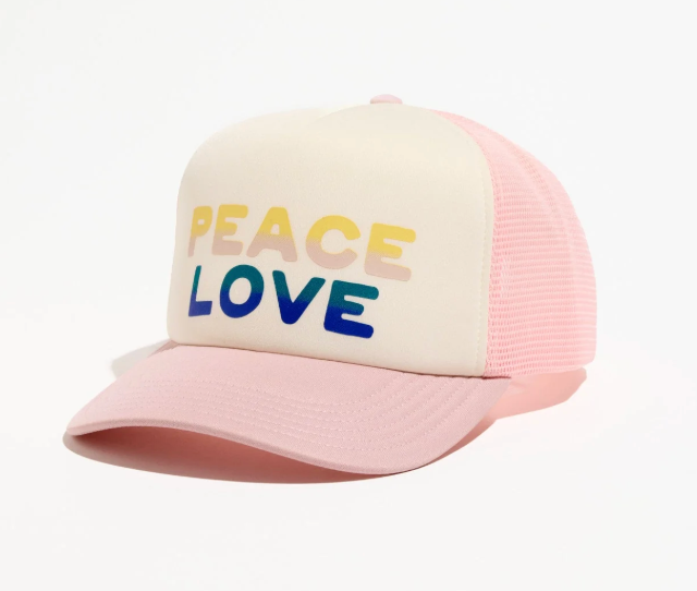Pink and beige cap with 'PEACE LOVE' text on a white background