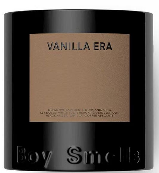 Black candle with 'Vanilla Era' label and 'Boy Smells' branding