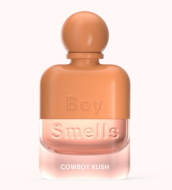 Perfume bottle labeled 'Boy Smells Cowboy Kush' on a white background