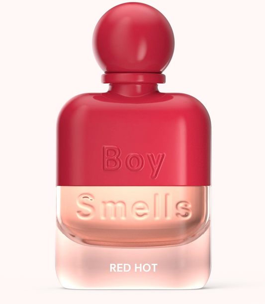 Red perfume bottle labeled 'Boy Smells Red Hot' on a white background