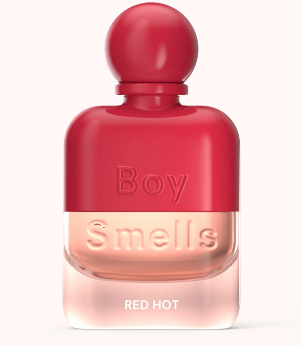 Red perfume bottle labeled 'Boy Smells Red Hot' on a white background