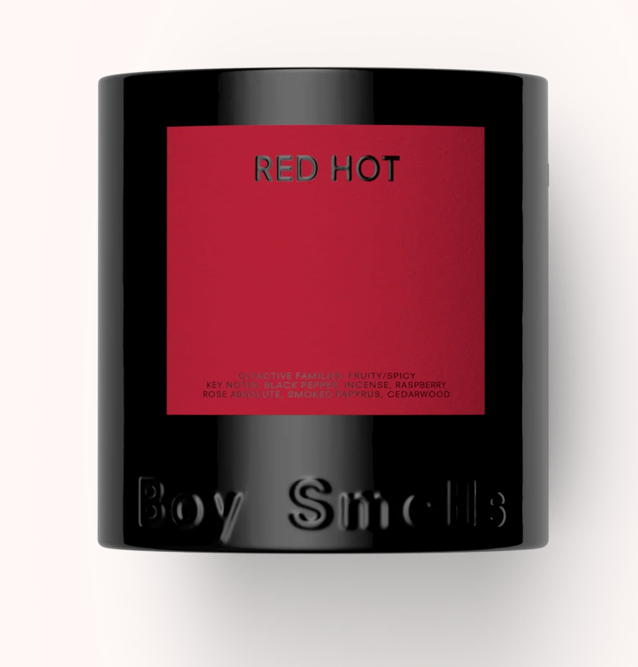 Candle with 'Red Hot' label and 'Boy Smells' branding on a white background