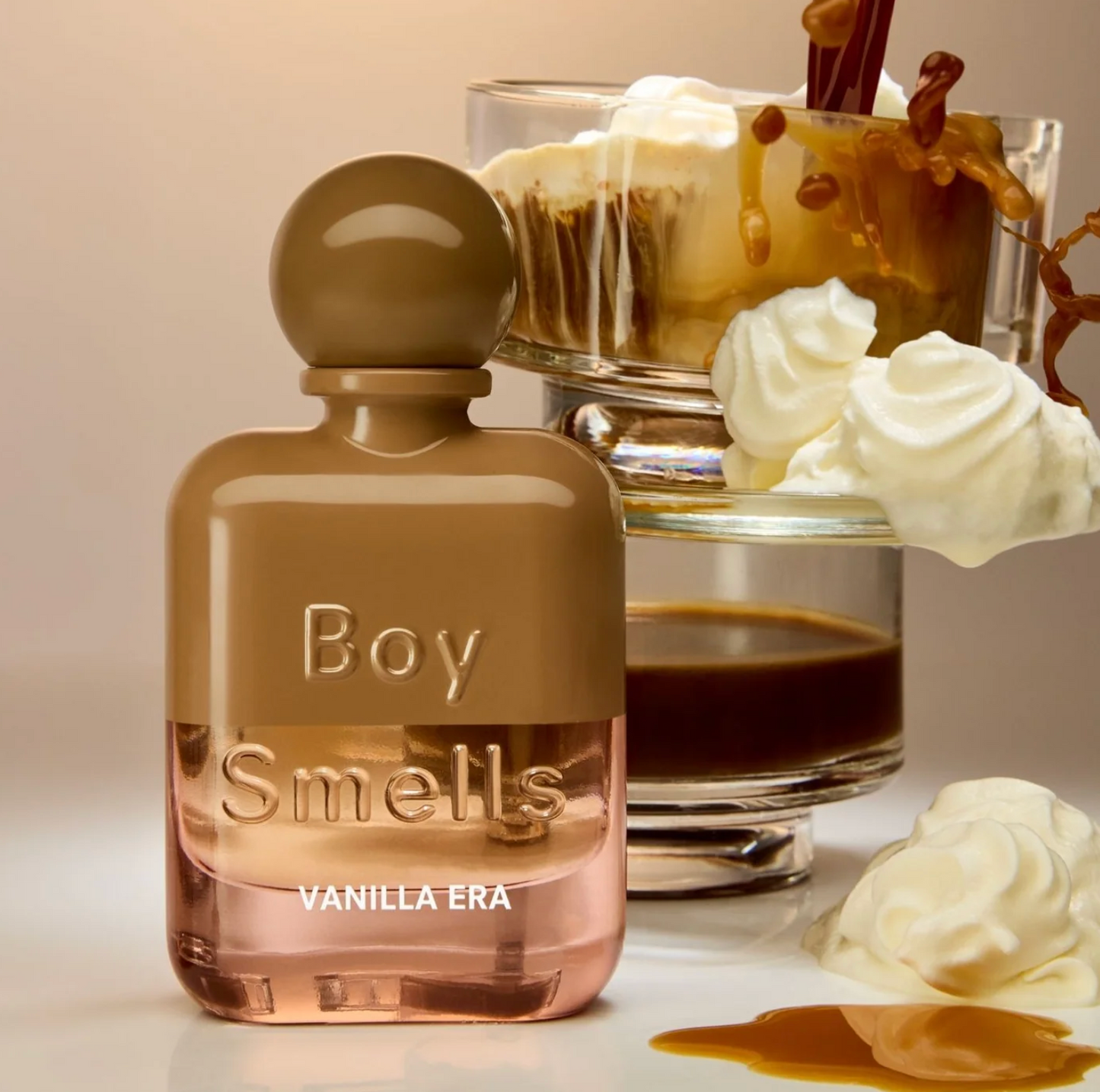 Perfume bottle labeled 'Boy Smells Vanilla Era' with a glass of vanilla ice cream and sauce.