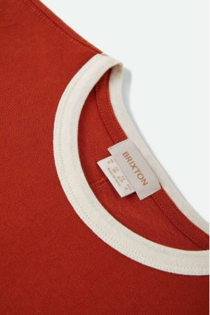 Close-up of a red shirt with a white collar and Brixton label.