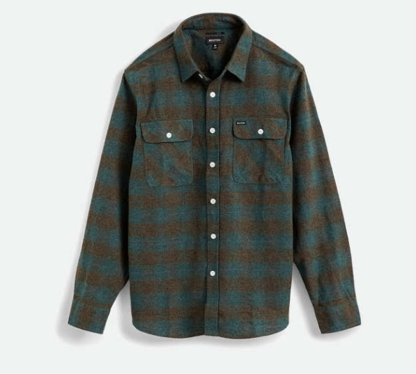 Plaid shirt with a green and brown pattern on a light gray background