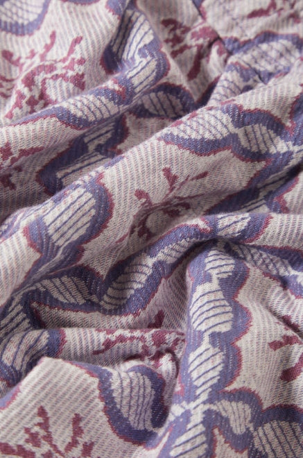 Close-up of textured fabric with purple and pink pattern
