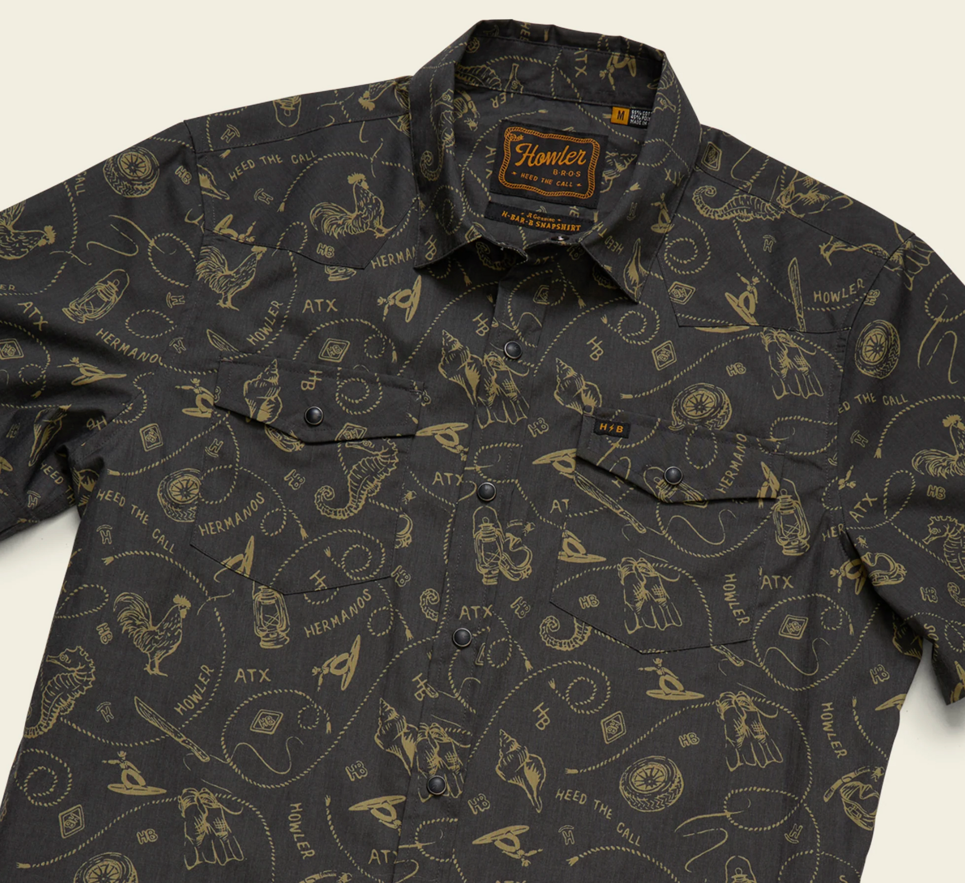 Dark patterned shirt with visible brand logo on a light background