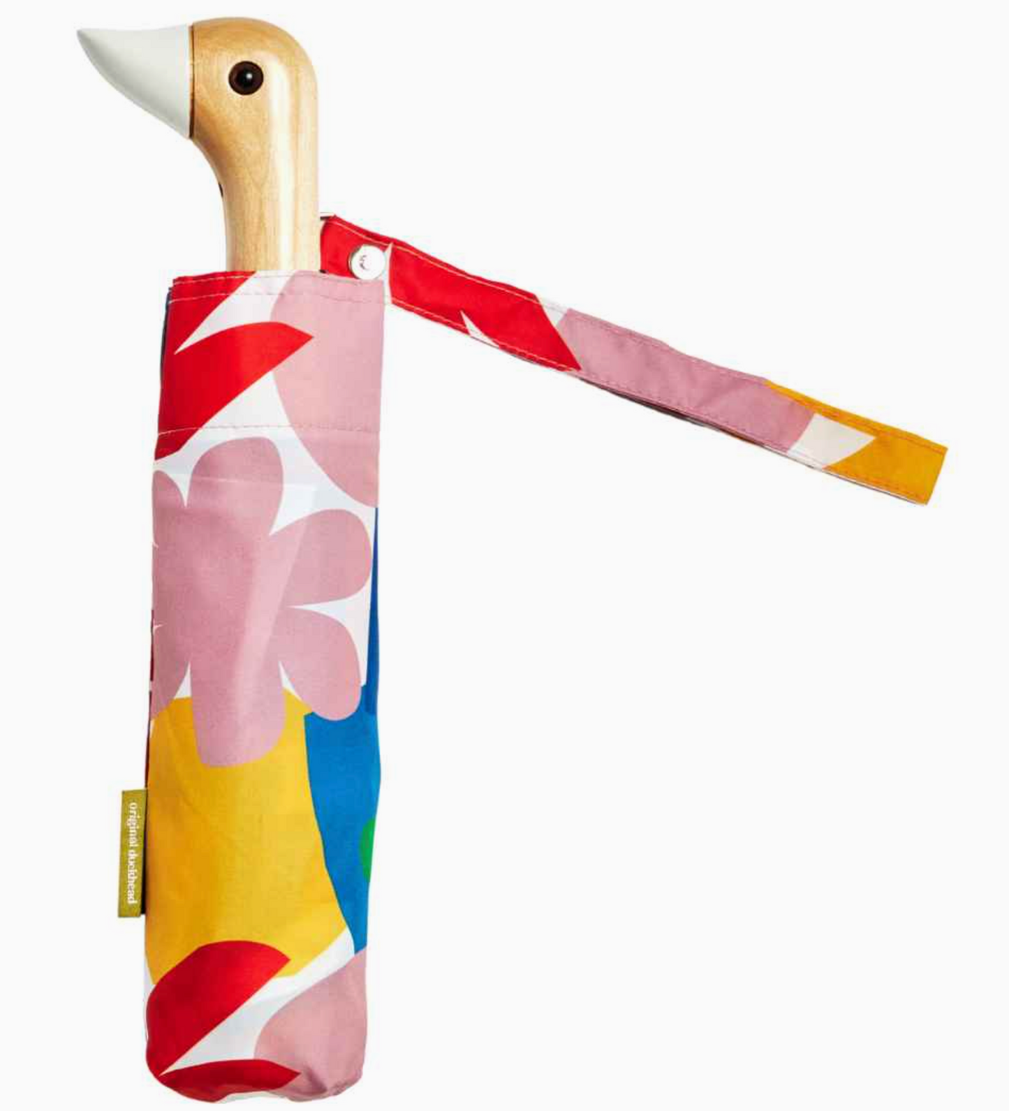 Colorful fabric-wrapped toy duck with a strap on a white background
