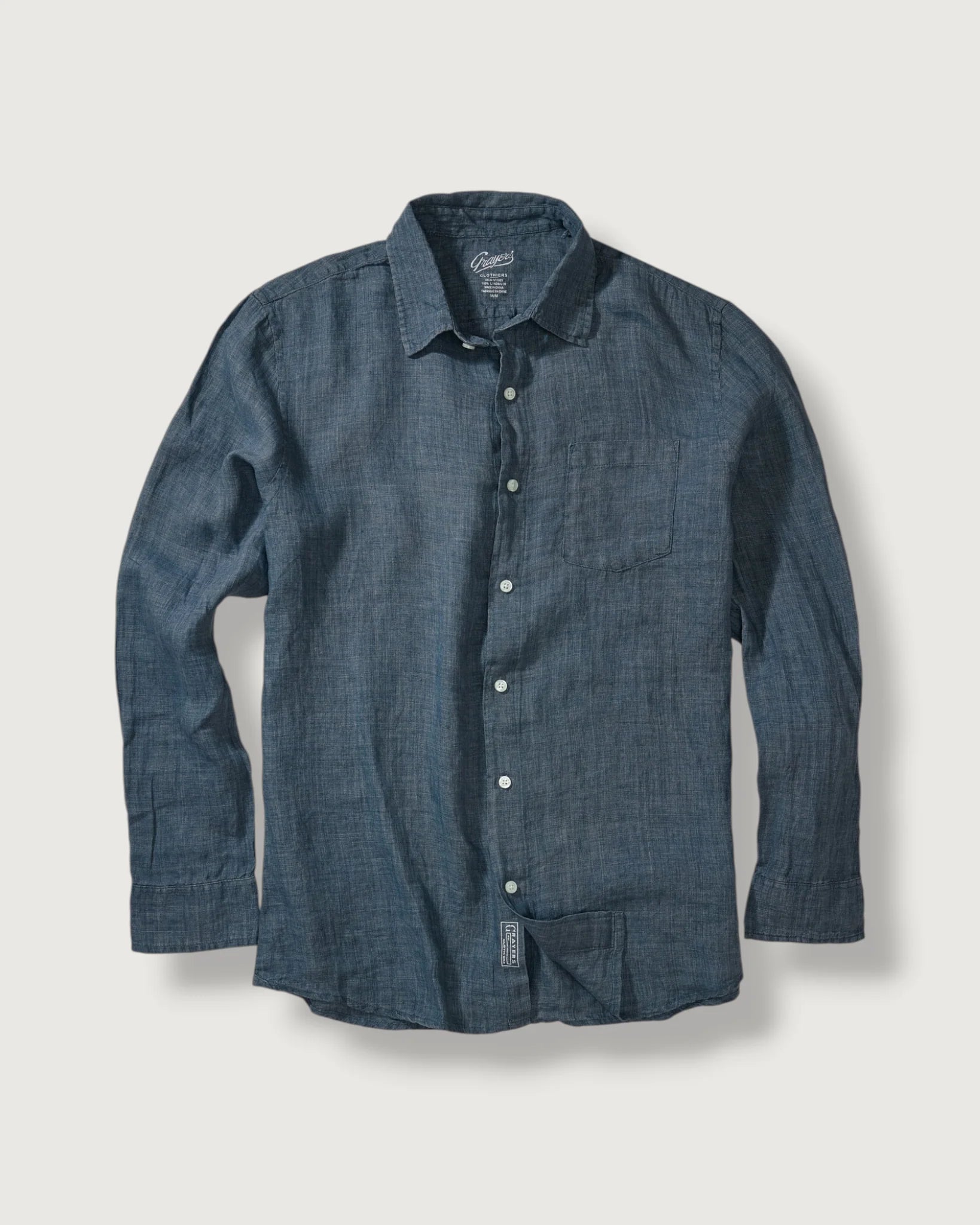 Blue denim shirt on a light gray background