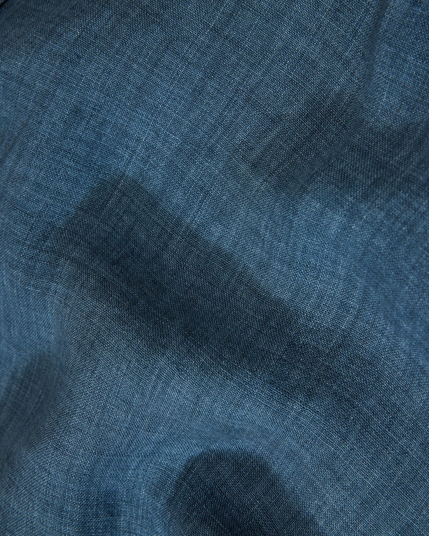 Close-up of blue fabric with a textured pattern
