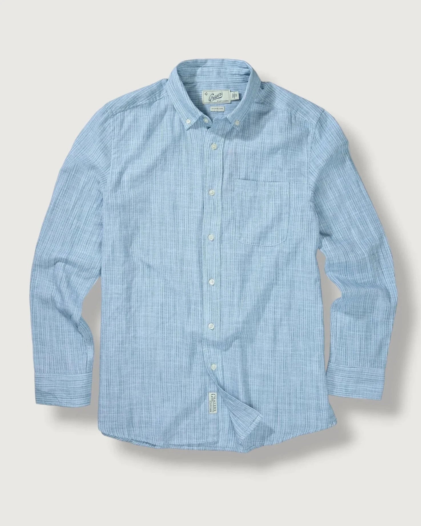 Blue checkered shirt on a light gray background