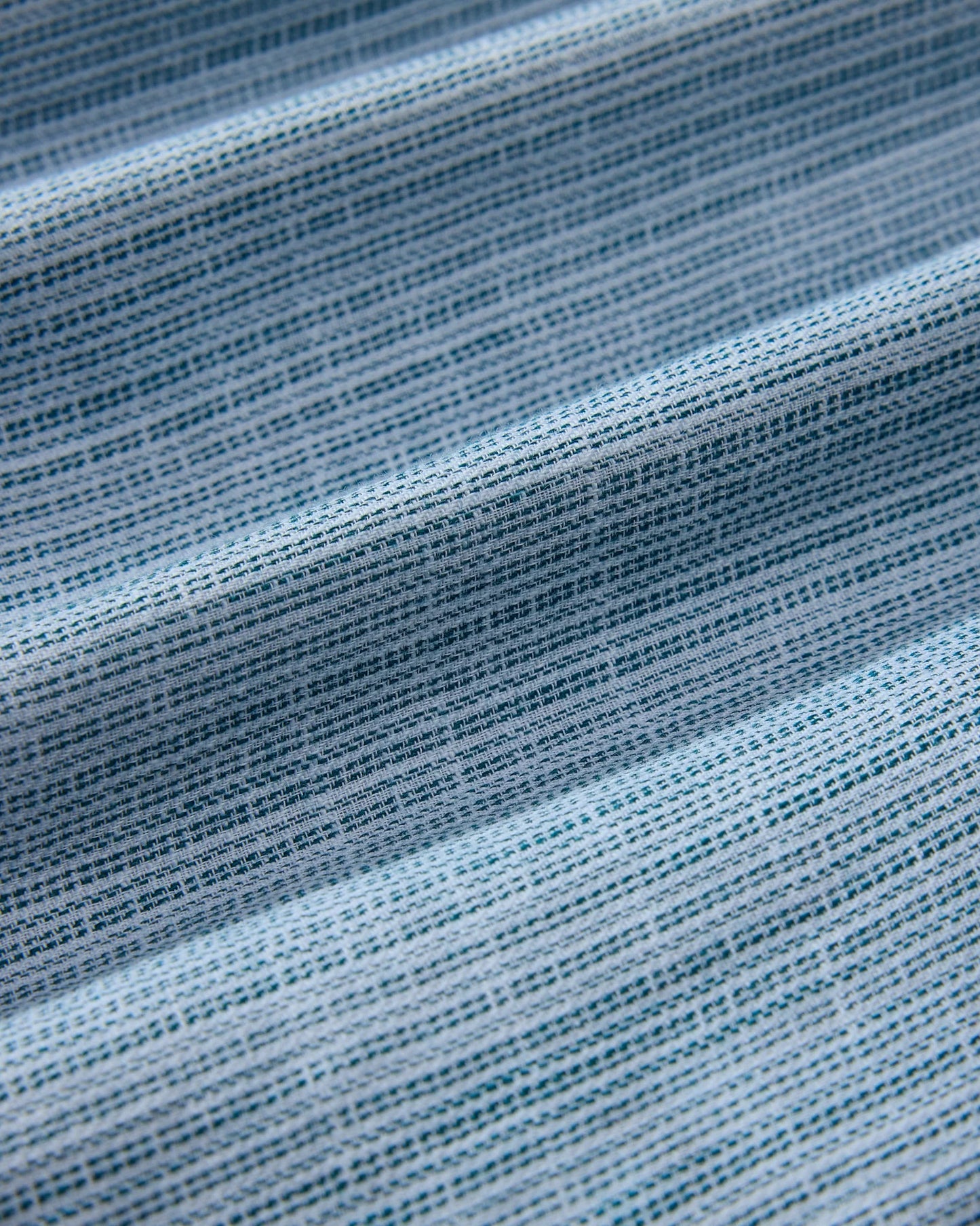 Close-up of blue fabric with a textured pattern