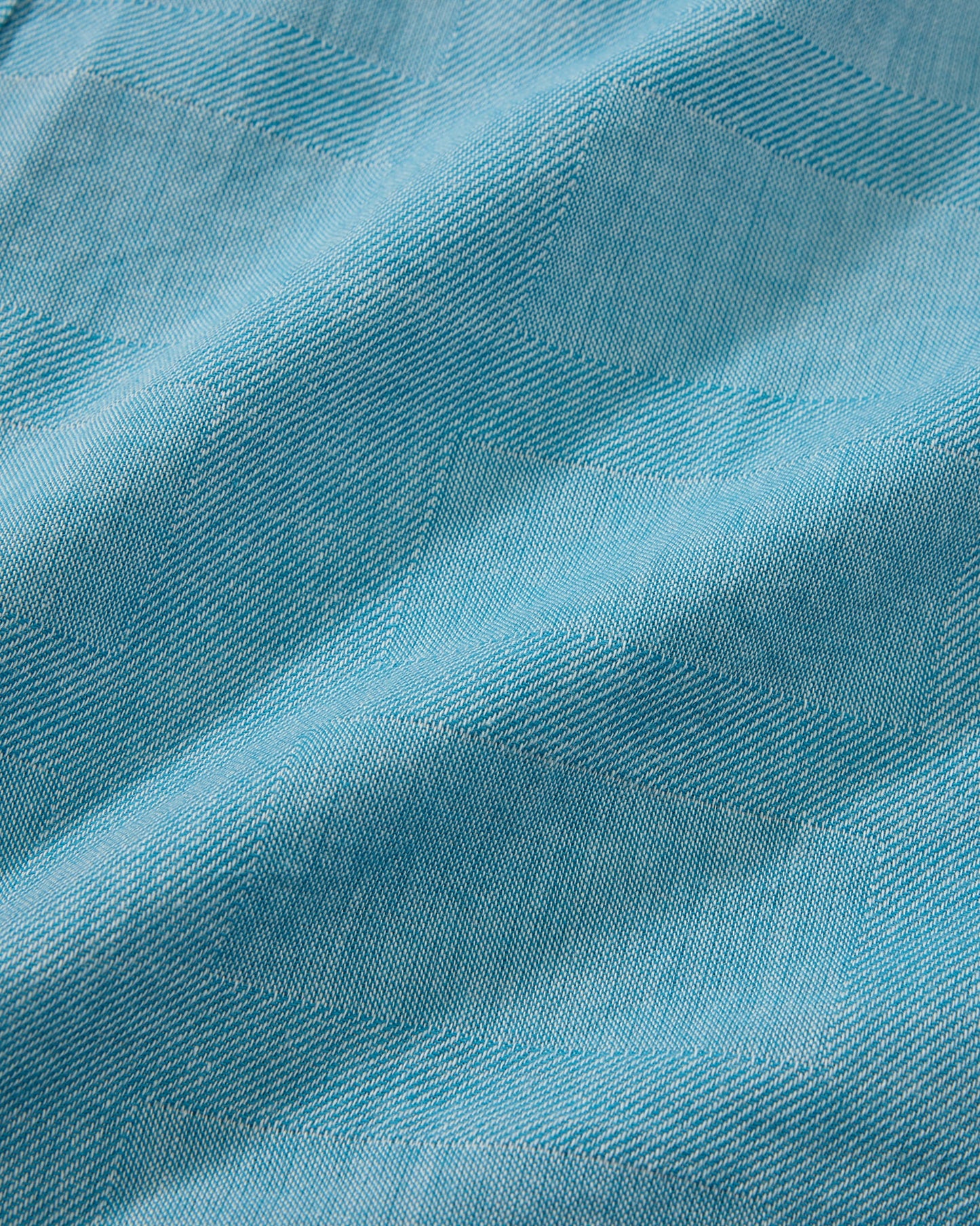 Close-up of blue fabric with a textured pattern