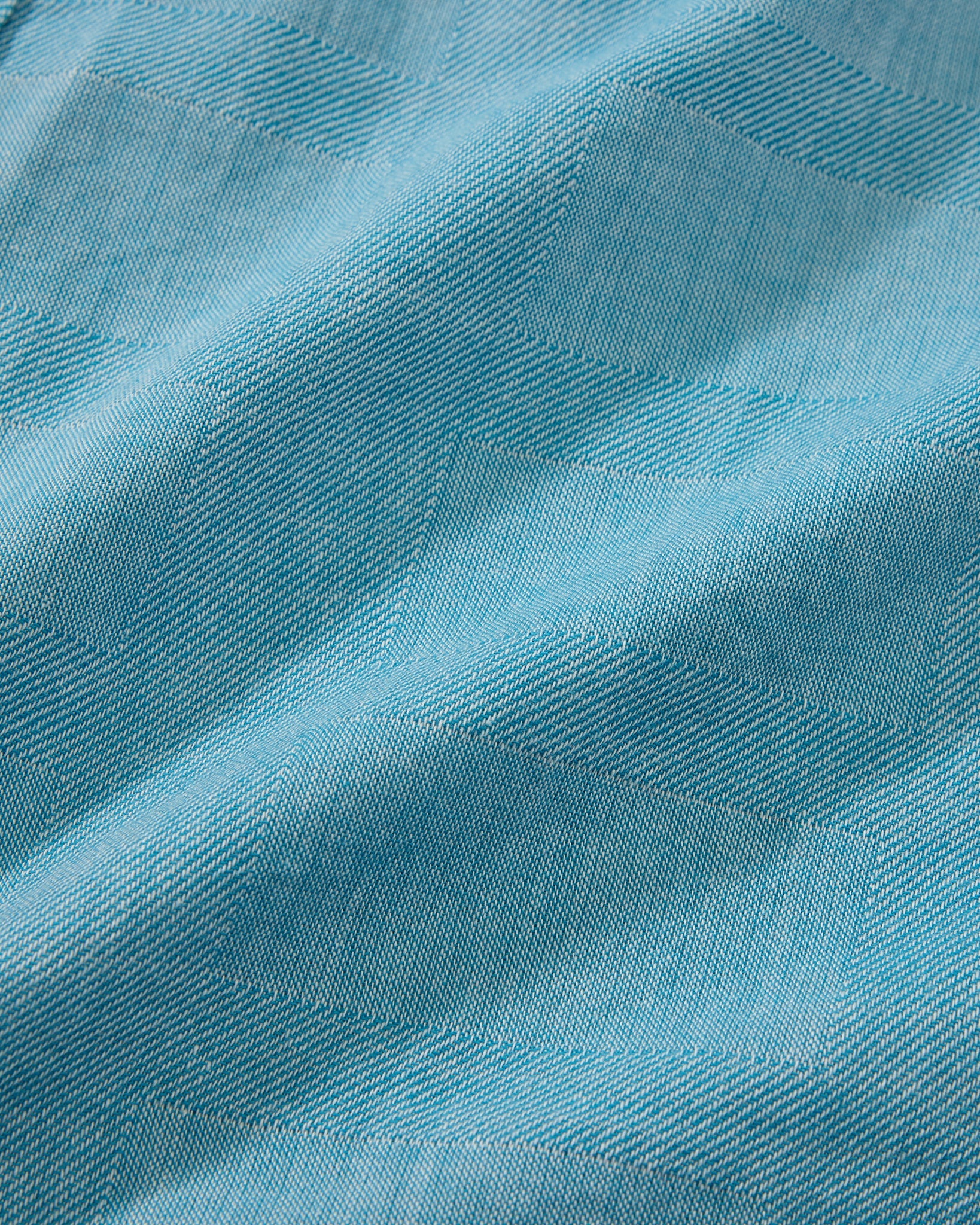 Close-up of blue fabric with a textured pattern