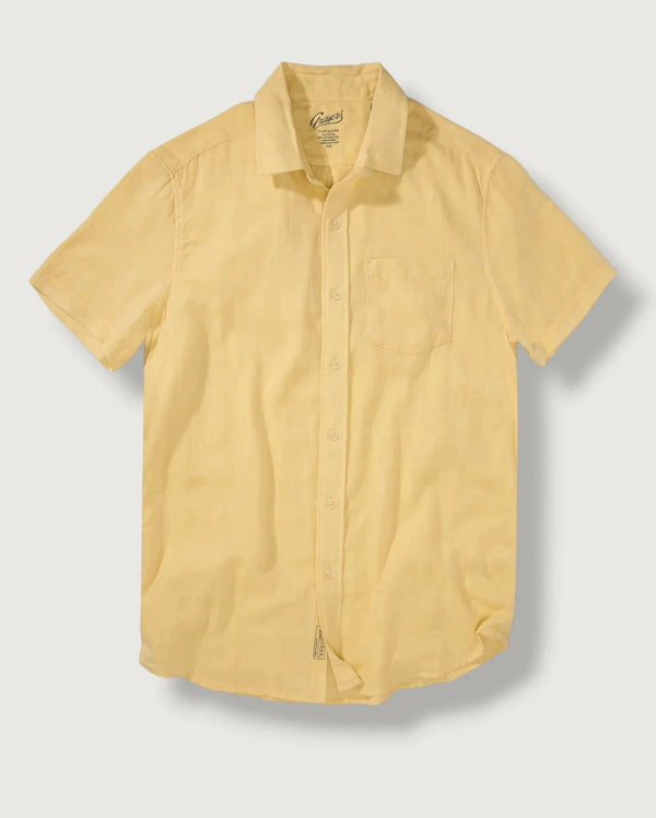 Yellow short-sleeve shirt on a light gray background