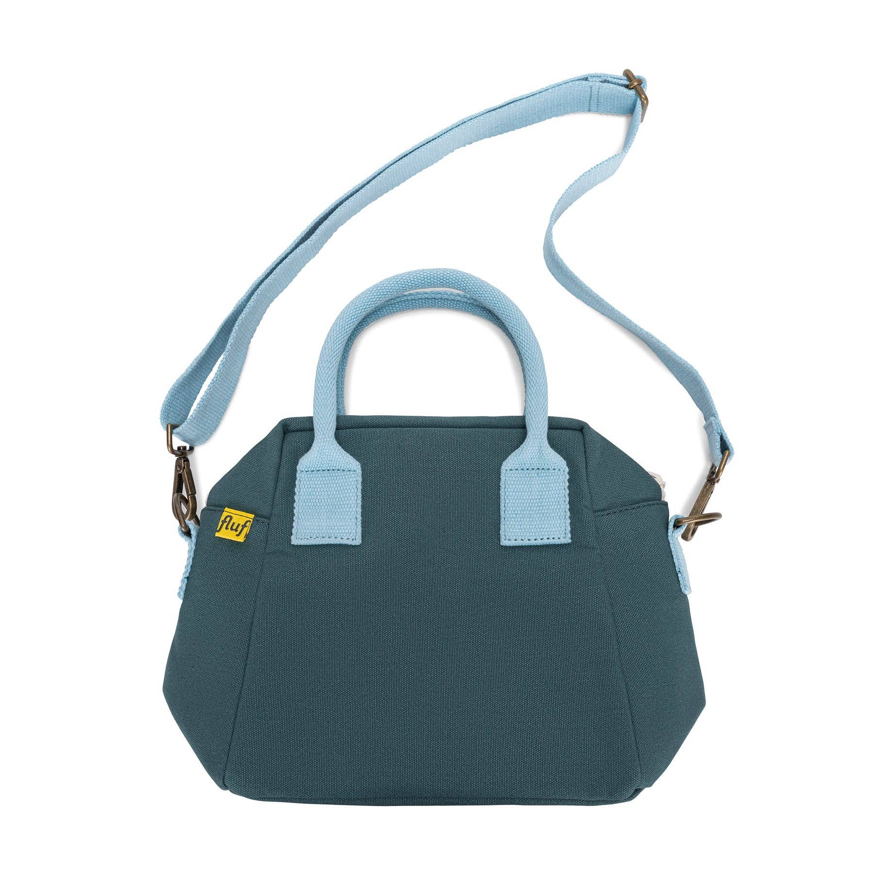 Blue handbag with matching strap on a white background