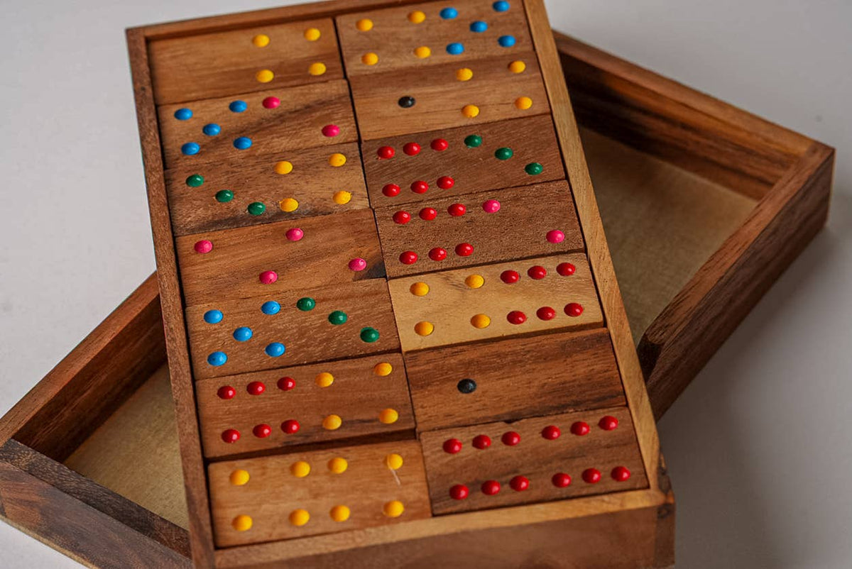 Wooden game set with colorful dots on a light background