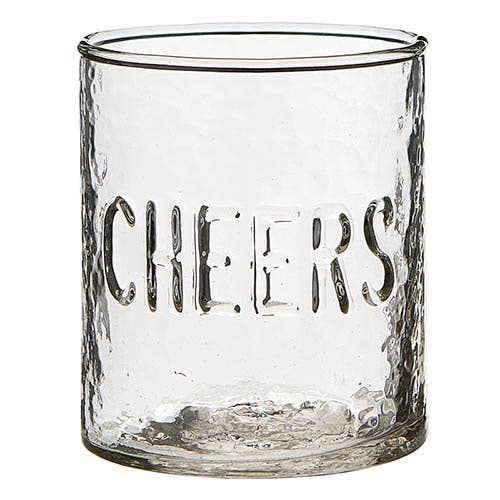 Clear glass tumbler with 'Cheers' engraving on a white background