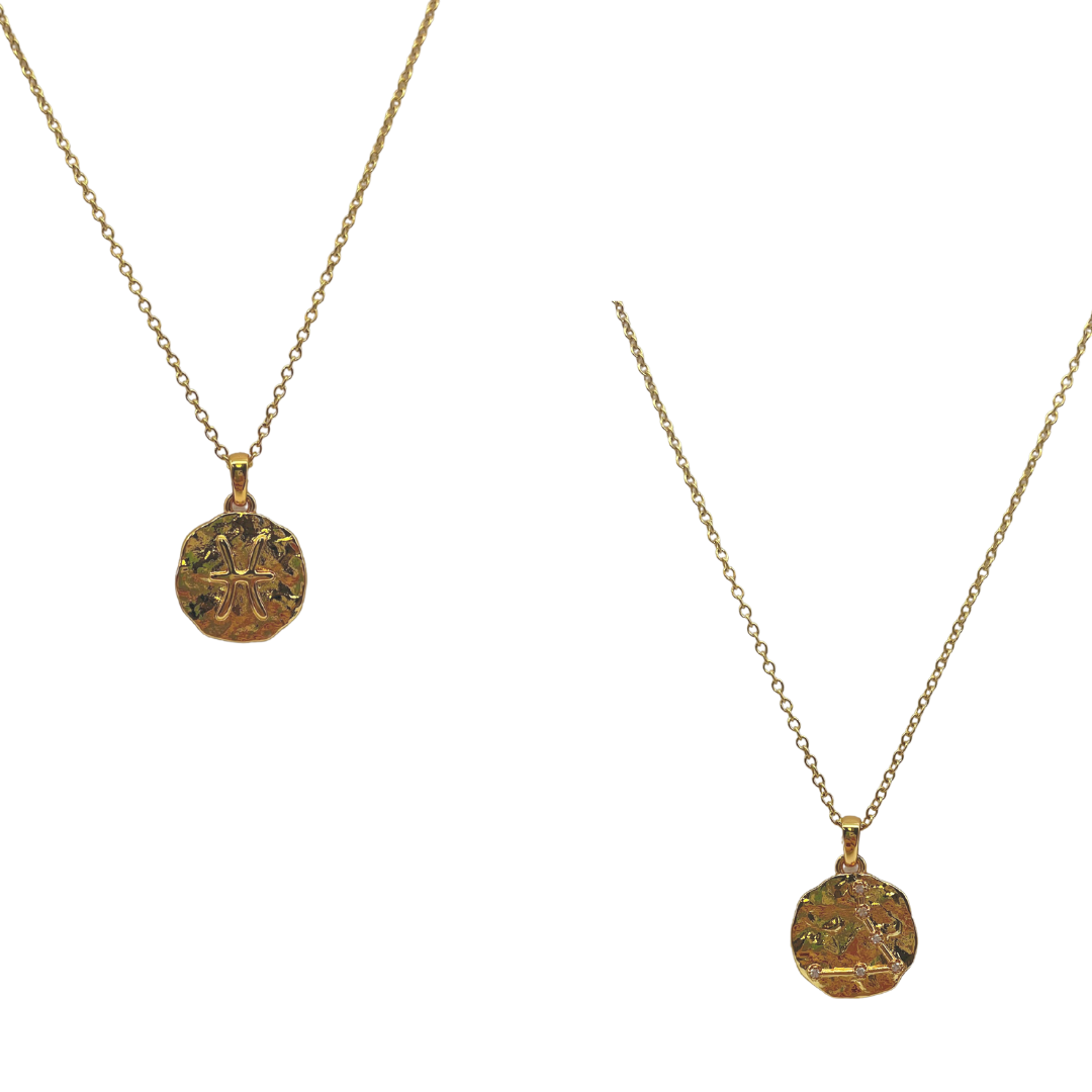 Two gold necklaces with circular pendants on a white background