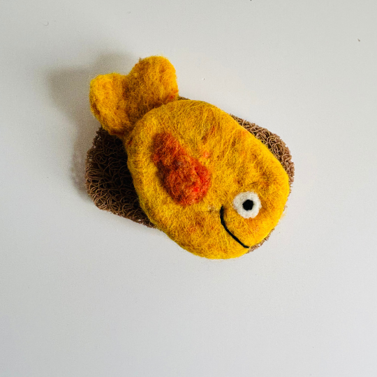Felted goldfish toy on a white background