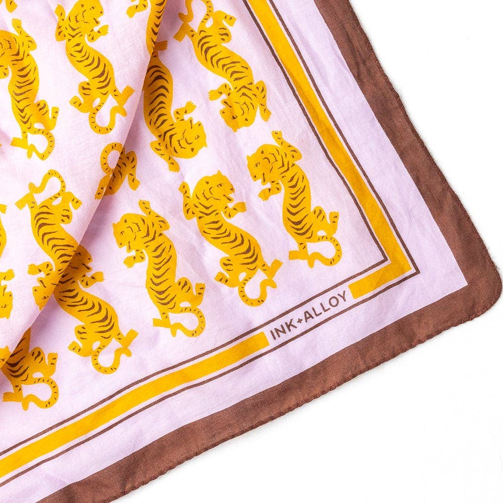 Scarf with yellow tiger pattern and 'Ink+Alloy' branding on a white background