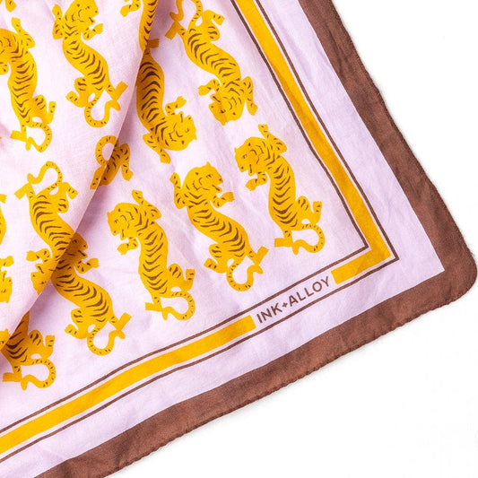 Scarf with yellow tiger pattern and 'Ink+Alloy' branding on a white background