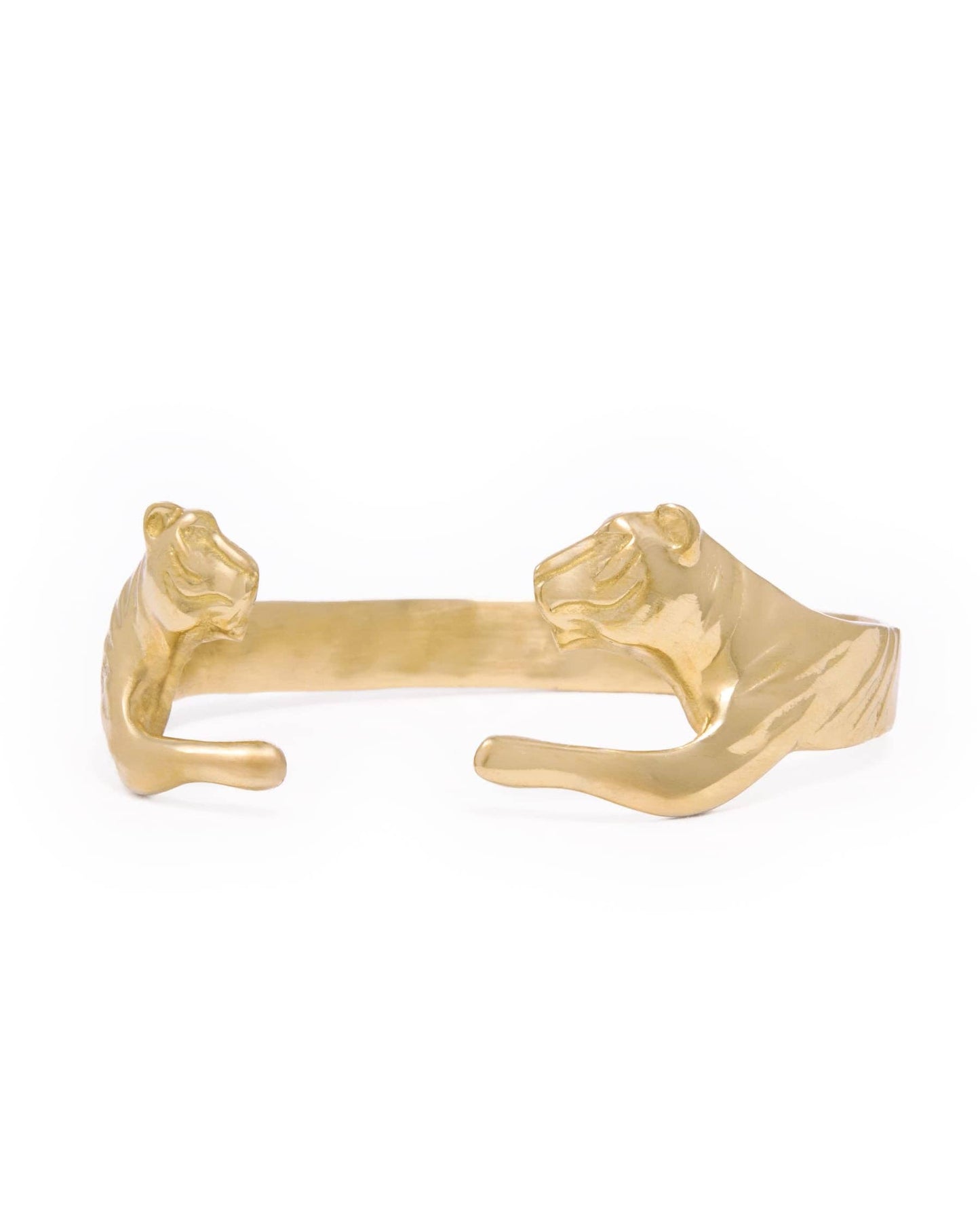 A gold-tone cuff bracelet featuring sculpted tiger heads on each end, shown against a plain white background.