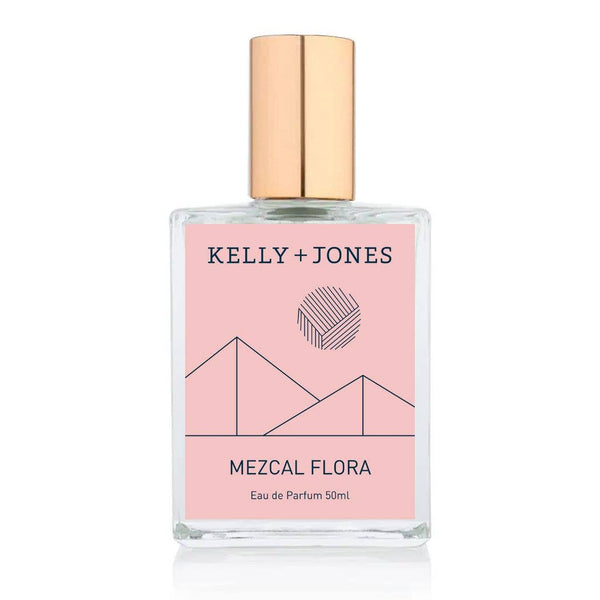 Perfume bottle with pink label featuring 'Kelly + Jones' and 'Mezcal Flora' on a white background