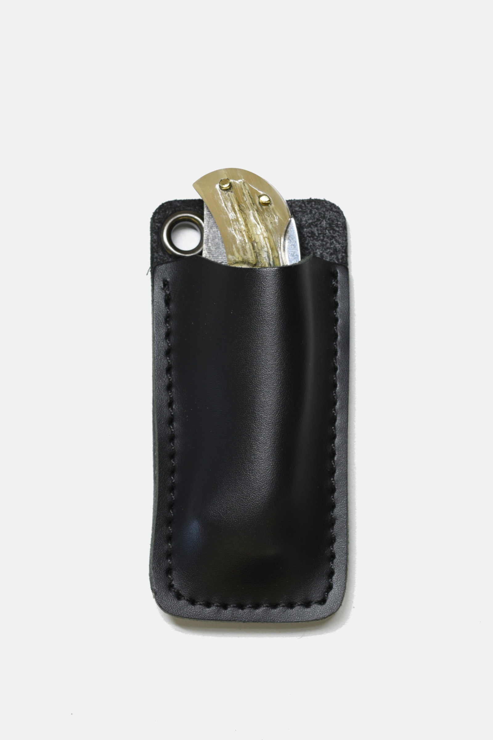Black leather wallet with a coin and card on a light gray background