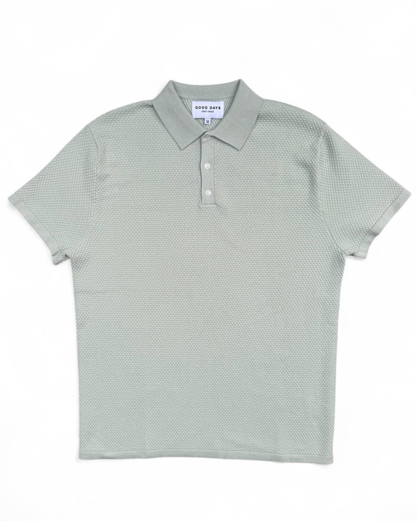 Light green polo shirt on a white background