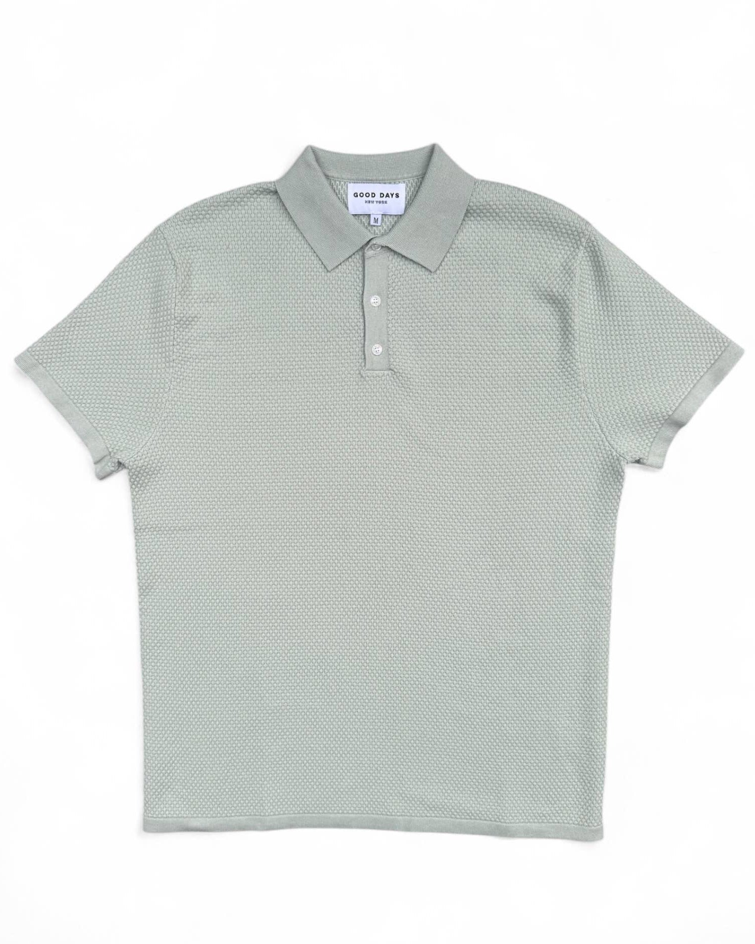 Light green polo shirt on a white background