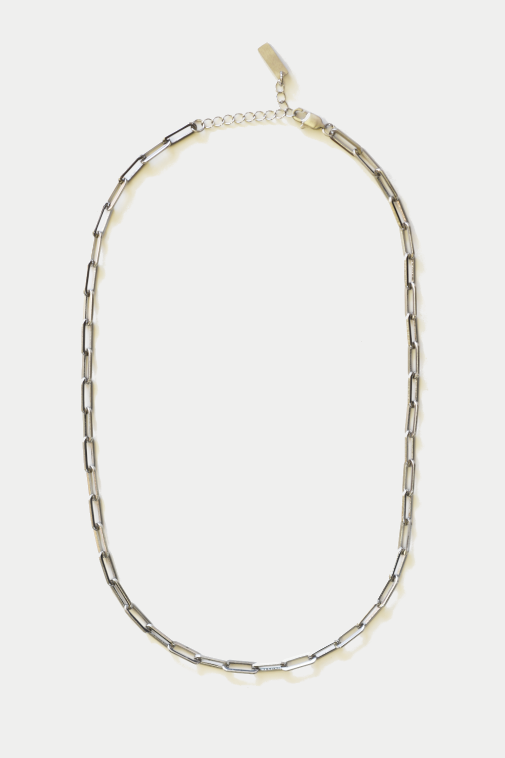 Silver chain necklace on a white background