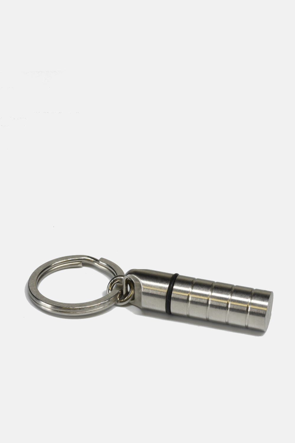 Metallic keychain with cylindrical component on a white background