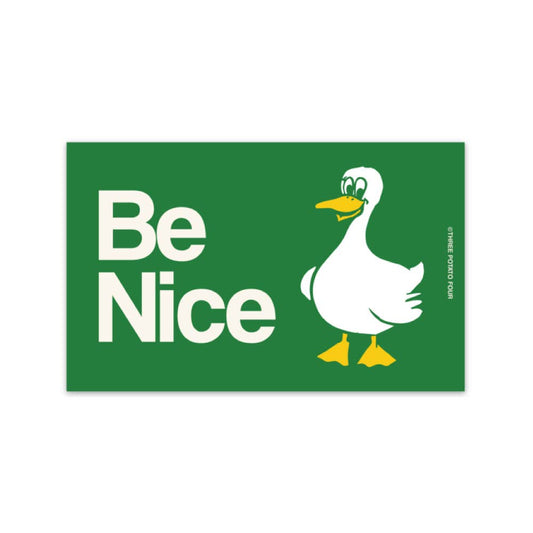 Green sign with a duck illustration and 'Be Nice' text on a white background