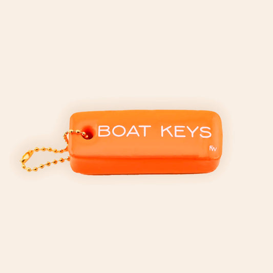 Orange key fob with 'BOAT KEYS' text on a beige background