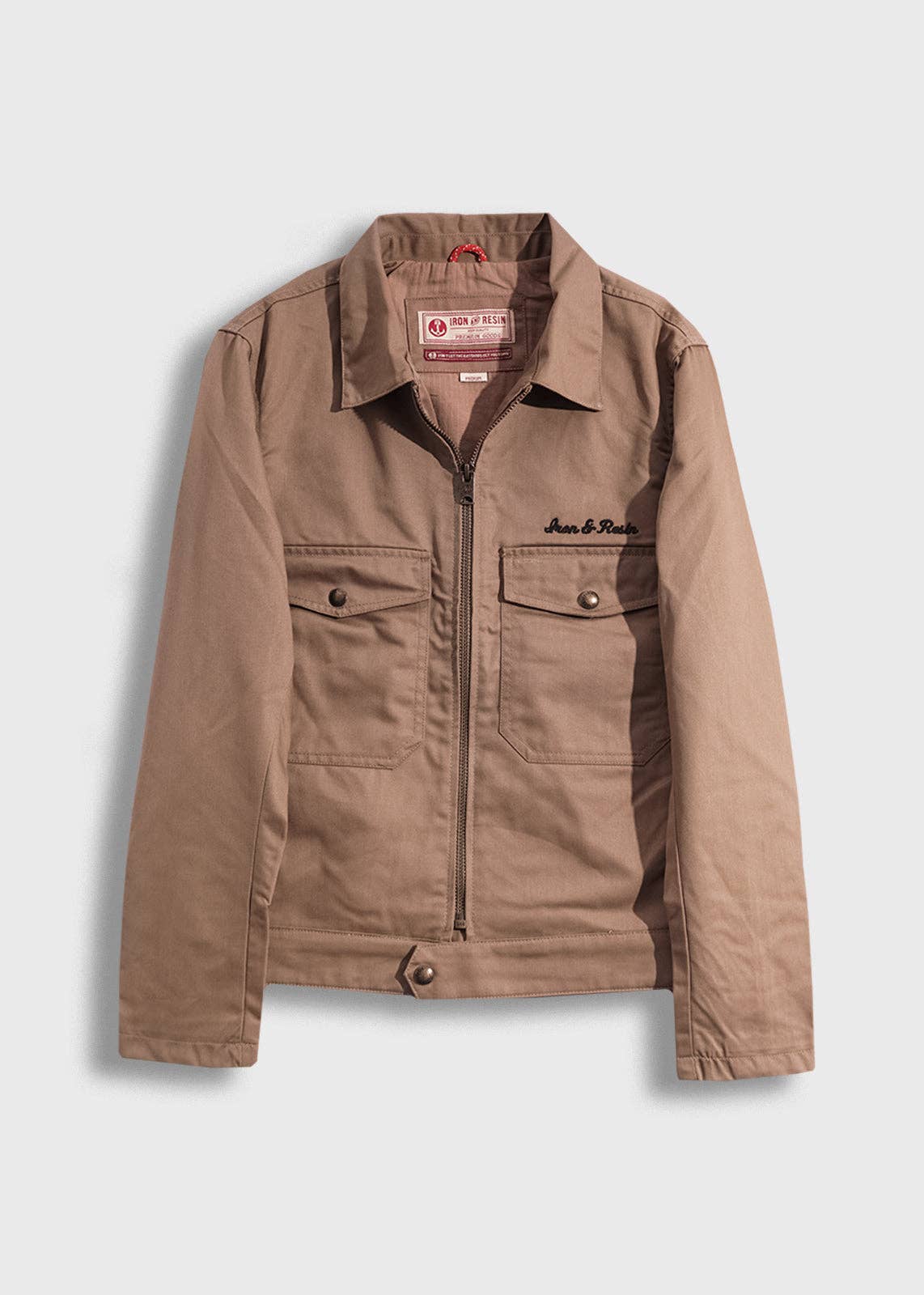 Brown jacket with a brand logo on a light gray background