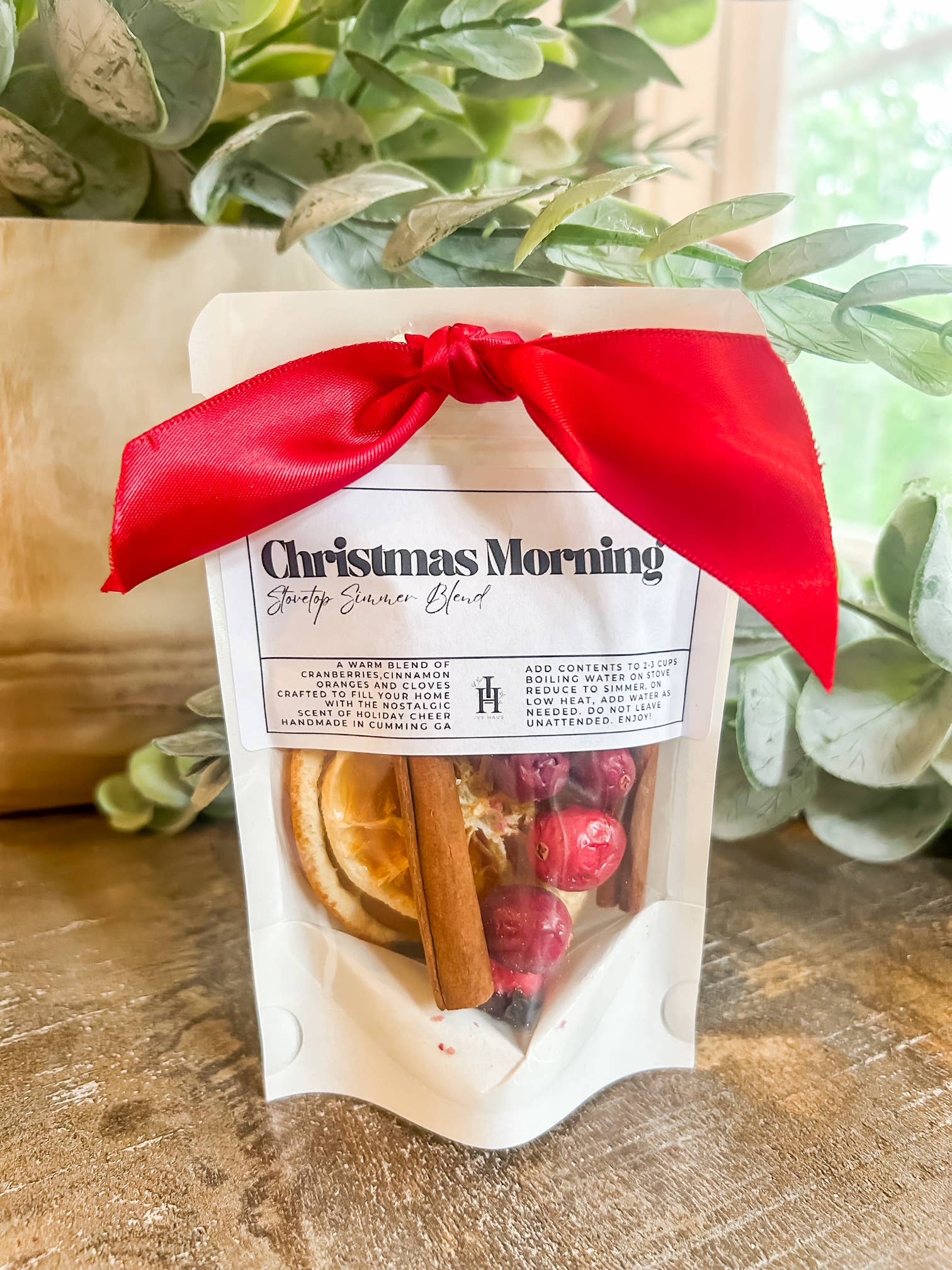 A festive Christmas simmer blend with cranberries, cinnamon sticks, and dried orange slices to fill your home with cozy holiday cheer.