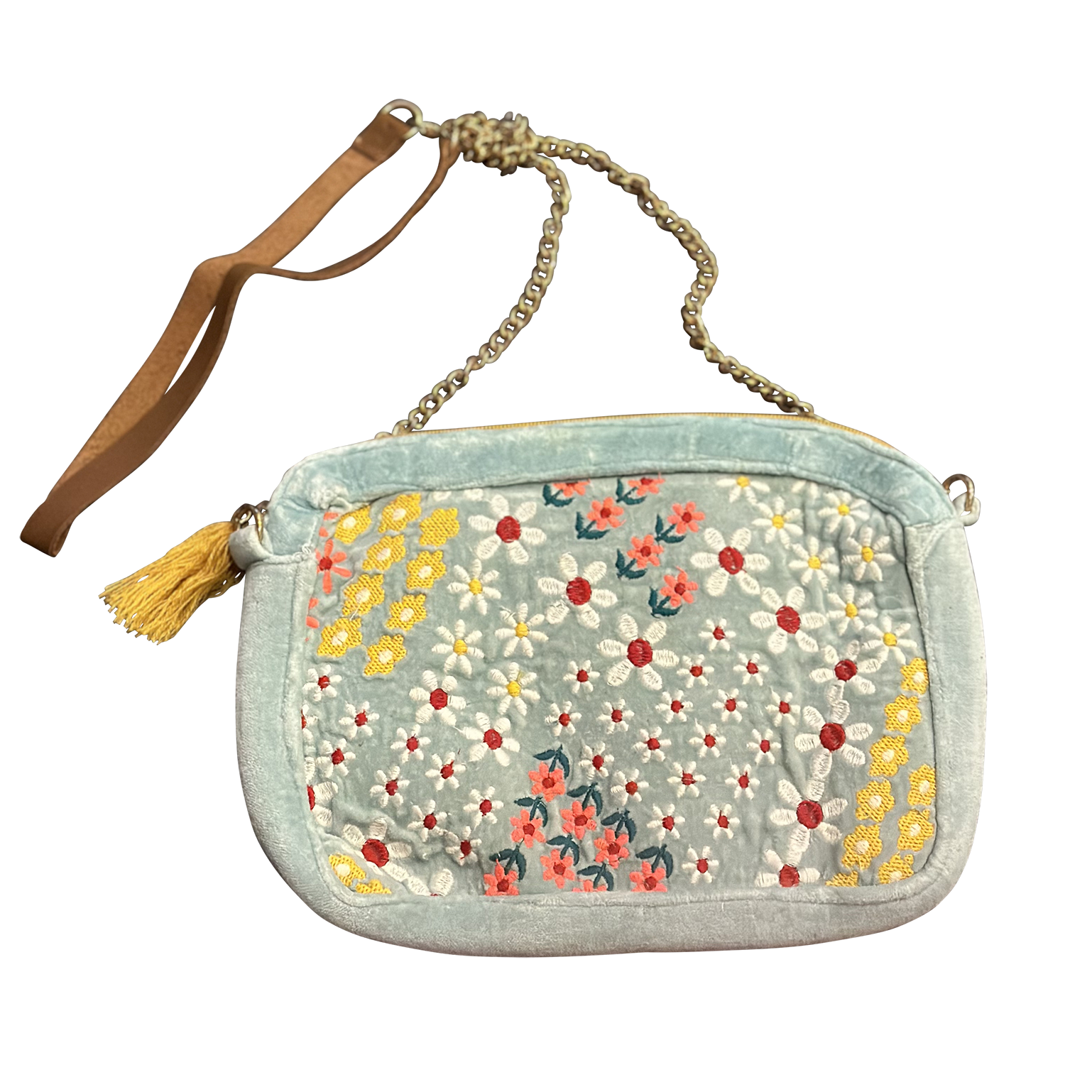 Floral patterned handbag with a tassel on a white background